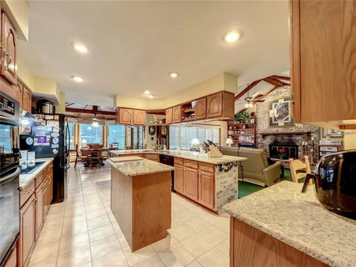 LVP Flooring with Honey Oak Kitchen Cabinets