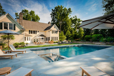 Inspiration for a timeless backyard rectangular hot tub remodel in New York