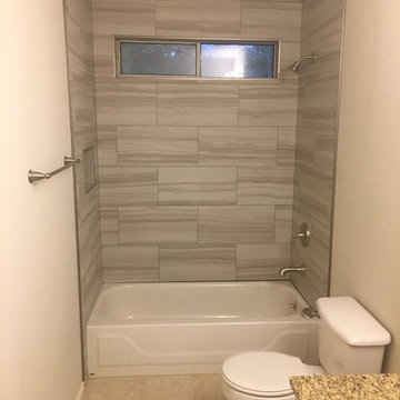 Bathroom - Gray 12" x 24" Tile Brick Pattern Tub Surround / Santa Cecilia Vanity