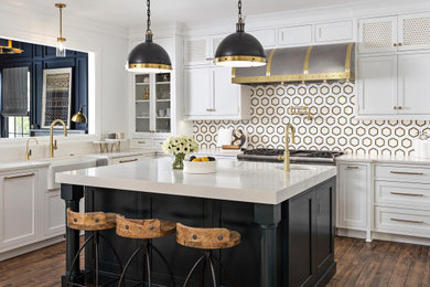 Kitchen - mid-sized transitional l-shaped medium tone wood floor and brown floor kitchen idea in Jacksonville with a farmhouse sink, beaded inset cabinets, blue cabinets, quartz countertops, multicolored backsplash, porcelain backsplash, stainless steel appliances and white countertops