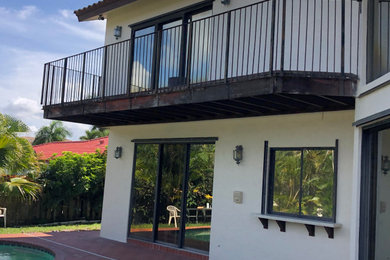 Balcony - modern metal railing balcony idea in Miami