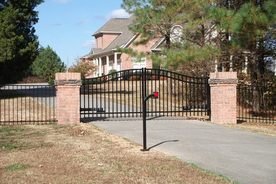 Inspiration for a mid-sized red two-story brick exterior home remodel in Other