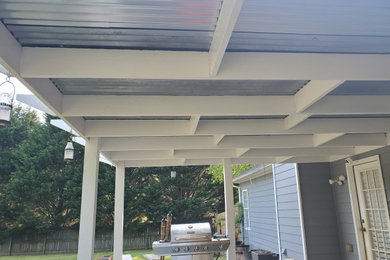 Inspiration for a mid-sized backyard patio remodel in Atlanta with a pergola
