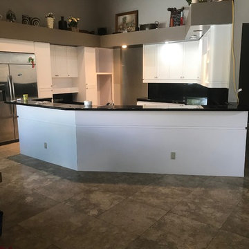 Resurfaced kichen with white, textured doors