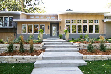 Inspiration for a large contemporary split-level wood exterior home remodel in San Diego