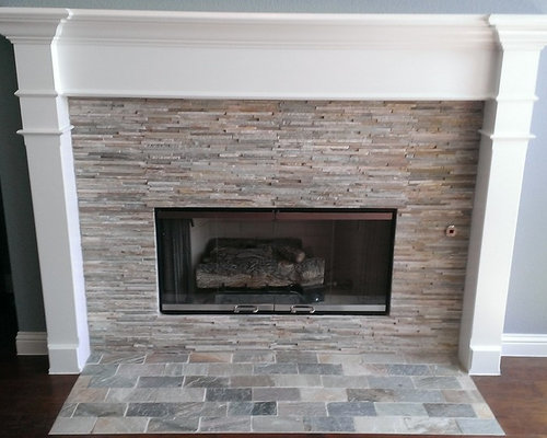 FIREPLACE - Mini-Ledger Stone Surround / Brick Pattern Stone Hearth Custom Surface Solutions (www.css-tile.com) - Owner Craig Thompson (512) 430-1215. This project shows a redone fireplace from Absolute Black granite tiles and bright brass frame glass doors to