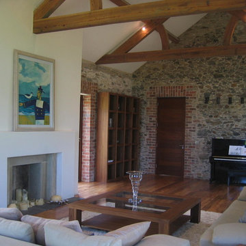 Hilltop stone farm buildings converted and extended to form modern family home