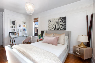 Mid-sized minimalist master light wood floor and brown floor bedroom photo in New York with white walls and no fireplace