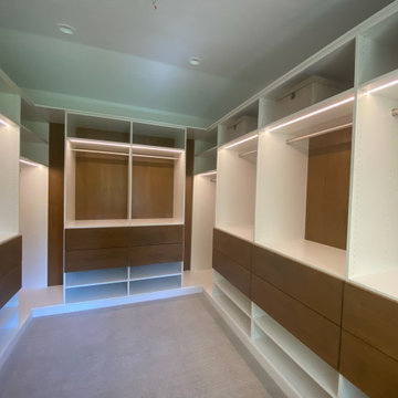 Modern Master Closet with Lighting and Drawers