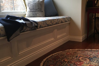 Hallway - small traditional medium tone wood floor and brown floor hallway idea in Other with beige walls