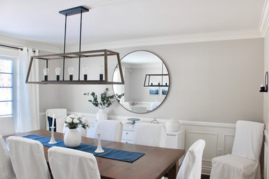 Enclosed dining room - mid-sized country dark wood floor and brown floor enclosed dining room idea in Other with no fireplace and gray walls