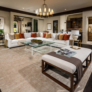 Design ideas for an expansive mediterranean open plan living room in Los Angeles with a home bar, white walls, dark hardwood flooring and brown floors.