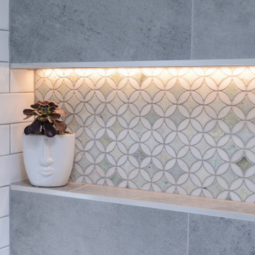 Modern bathroom with tiled shower niche