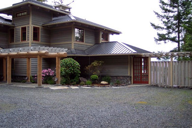 Inspiration for a large contemporary gray two-story wood exterior home remodel in Seattle