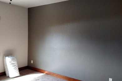 Bedroom - mid-sized traditional guest bedroom idea in Other with gray walls