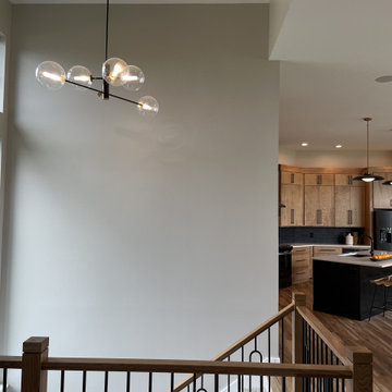 Angled Kitchen Design with Slab Style Cabinets in Pecan Stain
