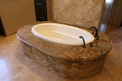 Example of a large classic master ceramic tile ceramic tile and beige floor bathroom design in Phoenix with beige walls and a hinged shower door