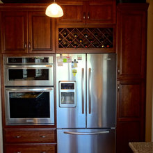 wine rack above fridge