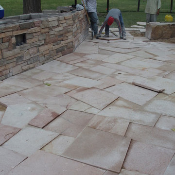 Great Flagstone Patio and Outdoor Kitchen with a Great Gas Fire Pit