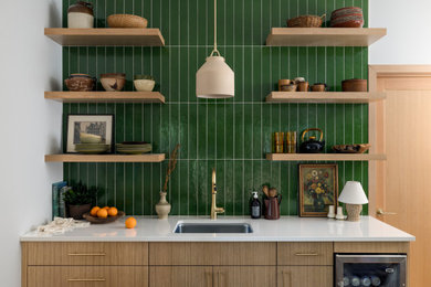 Kitchen - small contemporary single-wall light wood floor and brown floor kitchen idea in Seattle with an undermount sink, flat-panel cabinets, light wood cabinets, quartzite countertops, green backsplash, subway tile backsplash, no island and white countertops