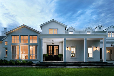 Inspiration for a large transitional white two-story mixed siding exterior home remodel in Dallas with a shingle roof