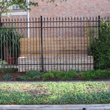 High function in a small side yard! Pergola, raised bed, mirrored wall, fountain