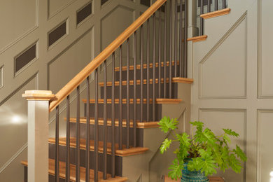 Elegant wooden wood railing and wood wall staircase photo in Boston with wooden risers