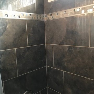 Custom Ceramic Tile Tub Surround with inlaid tile design