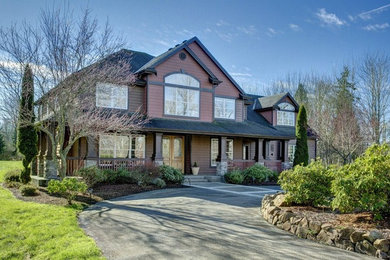 Large craftsman red two-story wood exterior home idea in Seattle