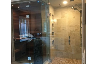 ボストンにある高級な広いモダンスタイルのおしゃれなマスターバスルーム (ダブルシャワー、ベージュのタイル、開き戸のシャワー) の写真