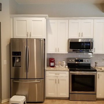Modern Kitchen Remodel Done in a Snow White Laminate