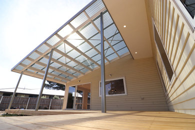 This is an example of a beach style deck in Hobart.