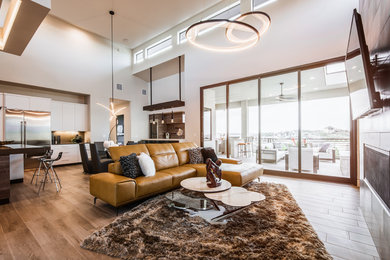 Inspiration for a large modern formal and open concept dark wood floor and brown floor living room remodel in Austin with beige walls, a ribbon fireplace, a metal fireplace and a wall-mounted tv