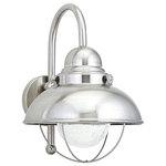 Seagull - Seagull  887193S98 LED Outdoor Wall Sconce SeaGull Sebring  Stainless - The Sea Gull Collection Sebring one light outdoor wall fixture in brushed stainless enhances the beauty of your property, makes your home safer and more secure, and increases the number of pleasurable hours you spend outdoors. This industrial and nautically inspired Sebring collection by Sea Gull Collection coordinates perfectly in coastal locations, while adding eye catching contrast to facades of any kind. Offered in Black, Brushed Stainless and Weathered Copper finishes, Sebring is a complete outdoor collection with small and large one-light outdoor wall lanterns, a one-light outdoor ceiling flush mount and one-light outdoor post lantern to unify any home's appearance. Incandescent as well as integrated LED are available. The advanced, integrated LED light source has warm-on-dim technology that warms in color when dimmed, and is California Title 24 compliant.