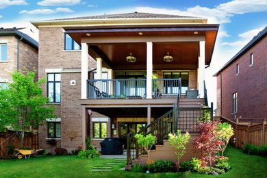 Example of a mid-sized trendy home design design in Toronto