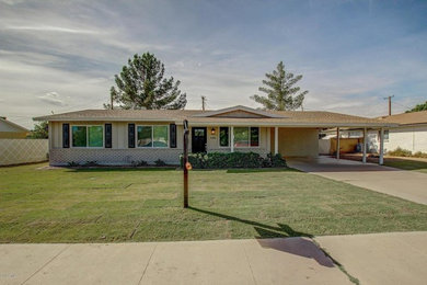 Inspiration for a transitional exterior home remodel in Phoenix