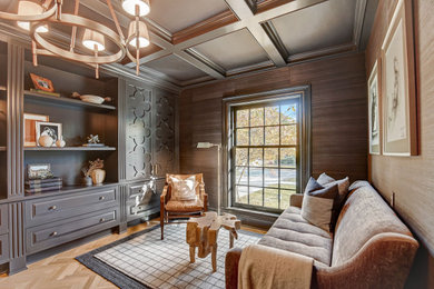 This is an example of a small traditional home office in Milwaukee with a reading nook, brown walls, light hardwood flooring, no fireplace, a freestanding desk, brown floors, a coffered ceiling and wallpapered walls.