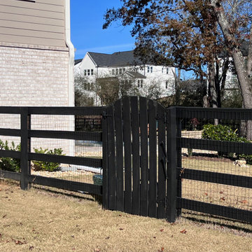 Black four rail gate with wire