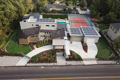 Large modern front full sun garden for summer in Salt Lake City with an outdoor sport court.