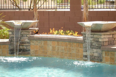 Inspiration for a mid-sized southwestern backyard custom-shaped pool remodel in Phoenix