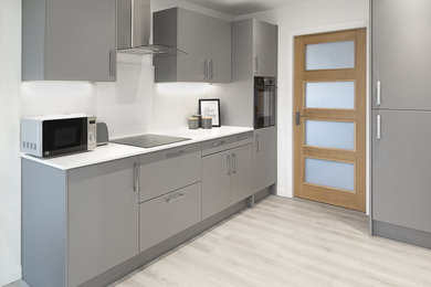 Inspiration for a modern grey and white open plan kitchen in Edinburgh with flat-panel cabinets, grey cabinets, black appliances, no island and white worktops.