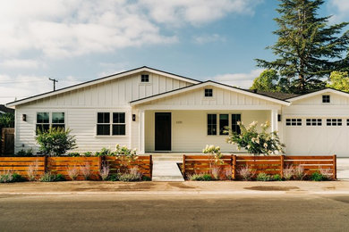 Inspiration for a mid-sized farmhouse full sun front yard stone landscaping in San Francisco.