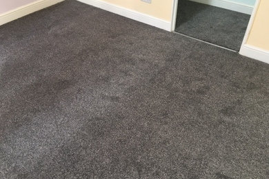 This is an example of a bedroom with carpet.