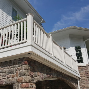 Estate Home with Covered Porch and Water Diversion System for Dry Space Below