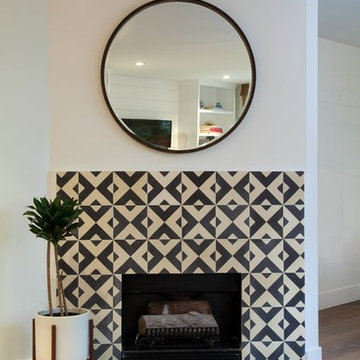 checkered past around the fireplace makes this living room remodel pop