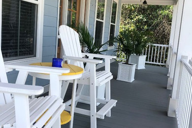 Mid-sized beach style front porch photo in Other with decking