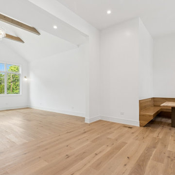 Custom Oak Breakfast Nook with Integrated Banquette and Vaulted Living View