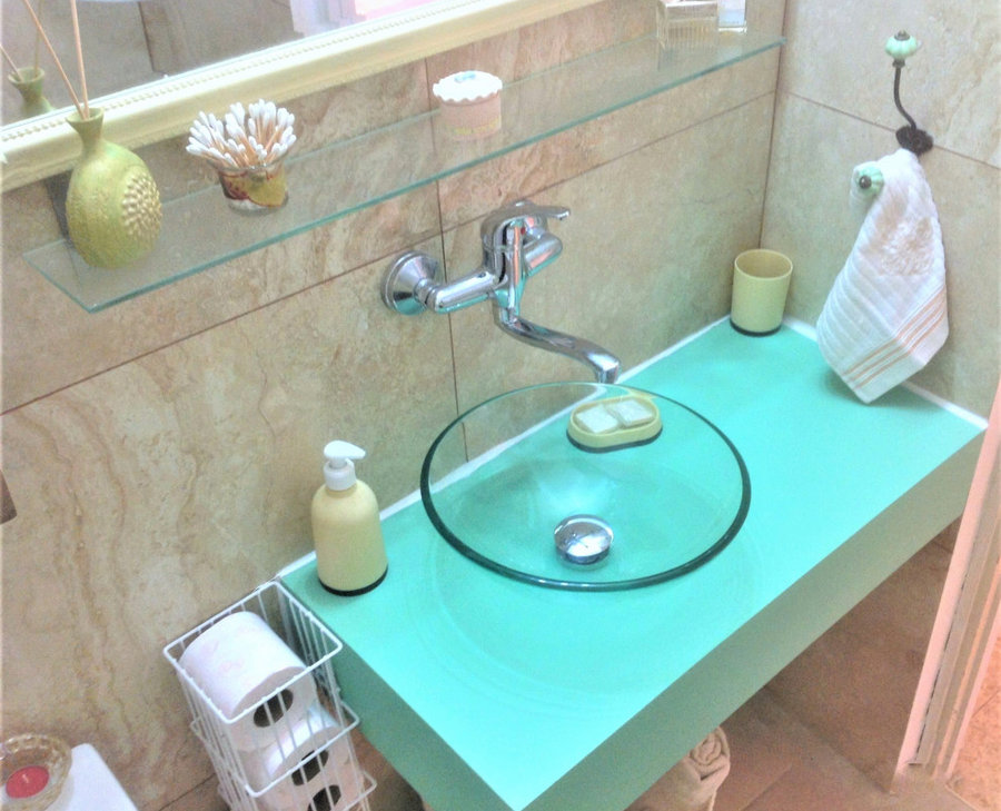 custom turquoise vanity with classy glass sink