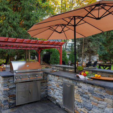 Make a Statement with a Versatile Outdoor Kitchen and Double Fire Feature