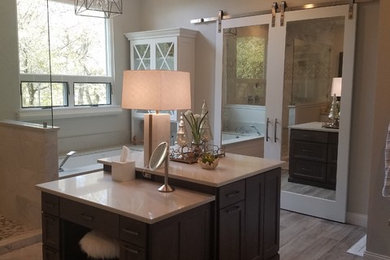 Bathroom - large transitional master white tile and marble tile ceramic tile bathroom idea in Dallas with recessed-panel cabinets, white cabinets, an undermount tub, a two-piece toilet, beige walls, an undermount sink and quartz countertops